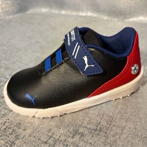 Puma Kids Black and Red Sneakers with Blue Accents